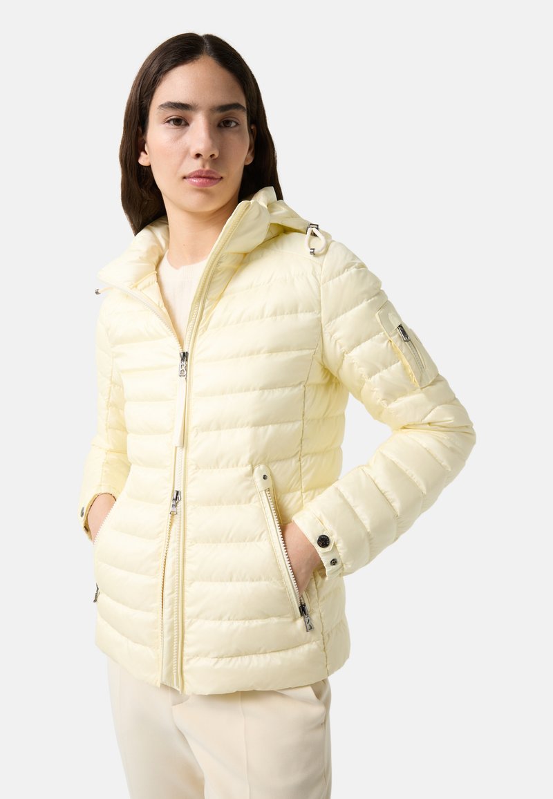 Yellow puffer jacket with a zippered front, hood, and side pockets. Features a quilted design and elasticized cuffs. Smooth, shiny texture.