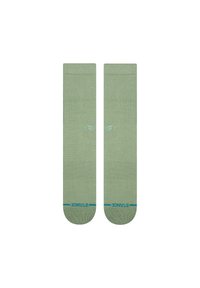 Sosete verzi din bumbac, cu o textură canelată, vârfuri întărite și un logo al mărcii de culoare albastră aproape de manșetă. Tricotate plat, cu o lungime până la jumătatea gambei.