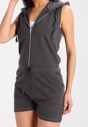 Combinaison à zip gris à capuche avec un design sans manches, taille ajustable par cordon et poches avant. Fabriquée en tissu doux et texturé.