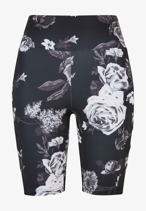 Mustade lillemustriga rattapüksid kõrge vöökohaga, millel on valged ja hallid roosid ning lehed kontrastse mustriga. Valmistatud siledast, venivast materjalist.