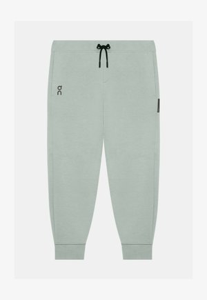Pantaloni jogger grigio chiaro con coulisse nera, polsini elastici, tasche laterali e piccolo logo sulla coscia sinistra.