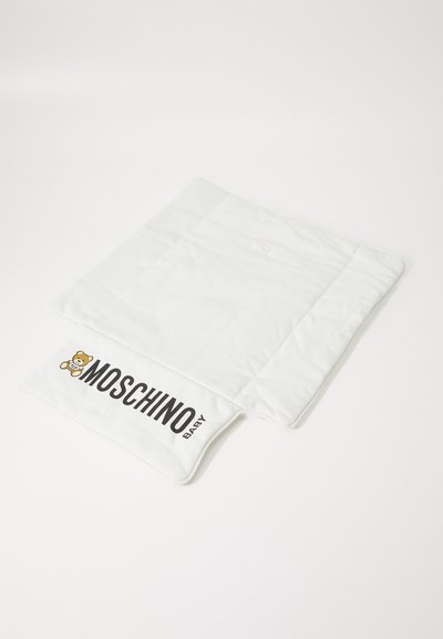 White changing mat with a quilted texture, featuring a black "MOSCHINO BABY" logo and teddy bear graphic on one side.