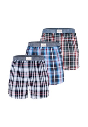 Tre par mænds ternede boksershorts i hvid, blå og sort med elastiske grå taljebånd og mærkeetiketter.