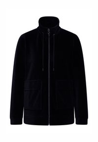 Chaqueta de pana negra con un cuello alto, cremallera frontal y dos bolsillos grandes. Cuenta con un cordón en el cuello y puños acanalados.