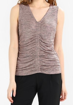 Sleeveless V-neck top with ruched fabric detail in a muted purple tone, worn with black pants on a standing person.