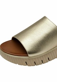 Sandale à glissière texturée dorée avec un bout ouvert, semelle intérieure rembourrée marron et semelle de traction épaisse beige. Présente un design lisse et minimaliste.