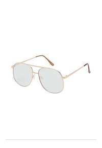 Gafas de sol estilo aviador con un delgado marco de metal dorado, lentes azul claro y patillas con puntas marrones. Presenta una forma ovalada clásica.