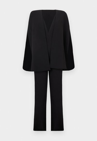 Black two-piece outfit consisting of a long-sleeve open-front top with an angled design and straight-leg pants, made from a smooth fabric.
