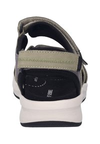 Takapään näkymä harmaasta sandaalista, jossa on säädettävät hihnat, musta pehmeä pohja ja valkoinen ulkopohja mustilla yksityiskohdilla.