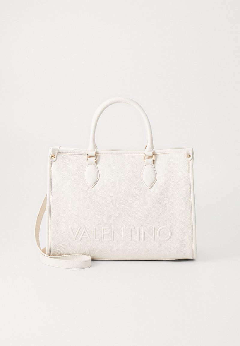 White leather handbag with top handles and a detachable shoulder strap. Features embossed brand name on the front and gold hardware accents.