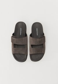 Grey suede sandals with two Velcro straps and a flat black outsole. The insoles feature the brand name "JACK & JONES" prominently.