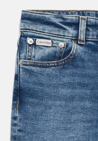 Calvin Klein Jeans DAD - Straight leg jeans - washed blue