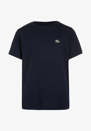 T-shirt bleu marine à manches courtes avec col rond et petit logo crocodile vert sur le côté gauche de la poitrine.