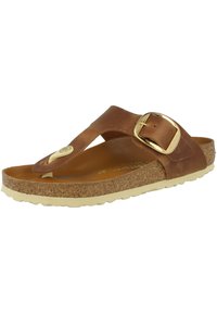 Sandale en cuir marron avec une boucle dorée, semelle en liège et semelle en caoutchouc beige avec un design texturé.
