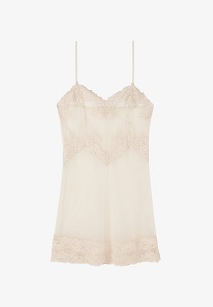 Beige cami met kantafwerking, voorzien van dunne verstelbare bandjes, een V-vormige halslijn en doorschijnende stof met bloemenkantaccenten.
