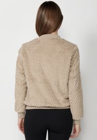 Koroshi Geacă bomber - beige