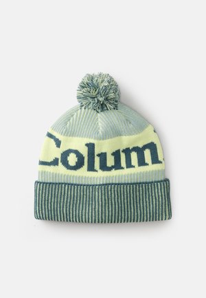 Gorro de punto en verde claro y azul con un pompón en la parte superior, que presenta un patrón de rayas horizontales y el texto "Columna" en lugar destacado.