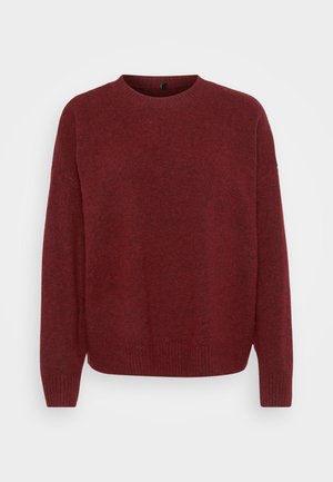 Raudonas megztinis su apvalia iškirpte, ilgomis rankovėmis ir tekstūruotu paviršiumi. Ribbinių apykaklės ir rankovių kraštai suteikia jauką prigludimą.