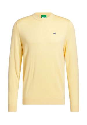 Keltainen neulottu villapaita, pyöreä pääntie, pitkät hihat, resorireunaiset hihansuut ja helmassa, pieni logo rinnassa, kevyt materiaali, rento istuvuus.