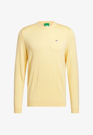 Keltainen neulottu villapaita, pyöreä pääntie, pitkät hihat, resorireunaiset hihansuut ja helmassa, pieni logo rinnassa, kevyt materiaali, rento istuvuus.