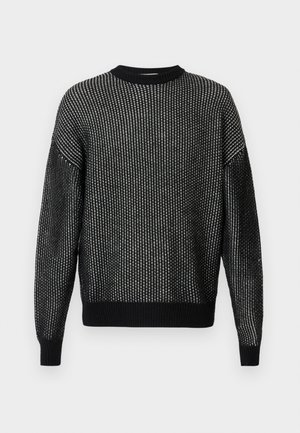 Black knitted sweater with a loose fit, featuring a textured pattern, ribbed neckline, cuffs, and hem. Long sleeves without visible seams.