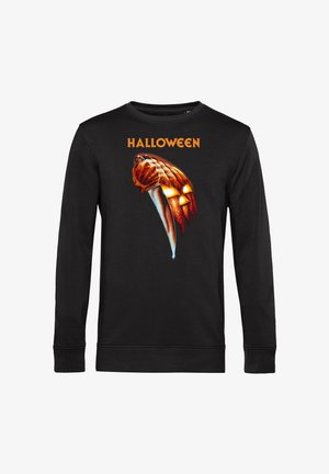 Zwarte sweatshirt met lange mouwen, voorzien van een grafisch ontwerp met een pompoen en een mes, versierd met het woord "HALLOWEEN" in oranje boven het ontwerp.