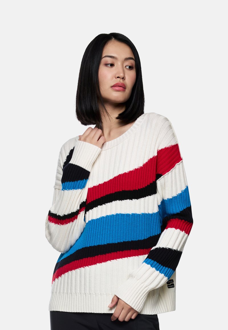 Rippstrickpullover in Creme mit auffälligen roten, blauen, schwarzen und weißen Streifen. Weit geschnittener Ausschnitt und verlängerte Ärmel. Strukturierter Stoff.