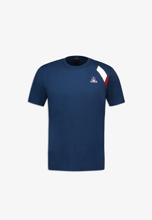 Navyblauwe katoenen t-shirt met korte mouwen, voorzien van een rood en witte diagonale streep en een logo op de linkerborst.