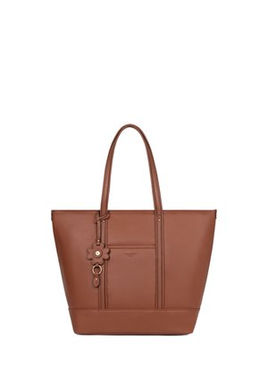 Sac fourre-tout en cuir marron avec doubles poignées, poche avant et porte-clés en forme de fleur, présenté sur fond blanc.