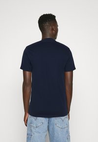 Hollister SOLID WEBEX T-Shirt print navy/dunkelblau Zalando