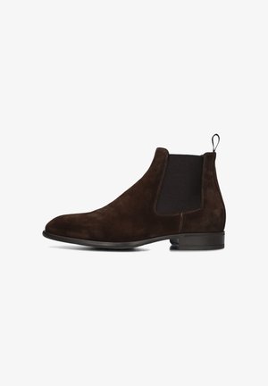 Brown suede Chelsea boots with elastic side panels, rounded toe, contrasting stitching, and a low heel. Accented with a pull tab.