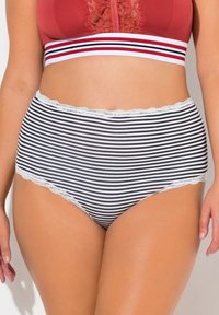 Culotte taille haute rayée noire et blanche avec une dentelle. Le tissu est doux avec une texture lisse. Dispose d'une taille élastique.