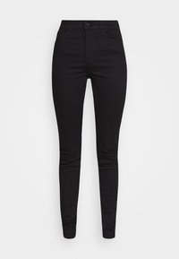 Jeans negros ajustados con una cintura alta, hechos de denim elástico. Presenta bolsillos frontales y cierre de botón. Textura suave, diseño minimalista.