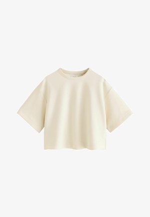 Tricou scurt de culoare crem, cu mâneci scurte și largi și decolteu rotund, prezentat pe un fundal alb.