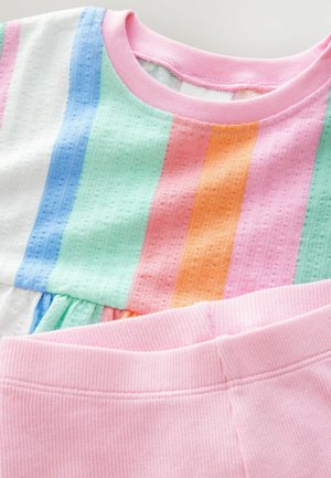 Striped top featuring blue, green, orange, pink, and white colors in a textured fabric, paired with solid pink ribbed pants.