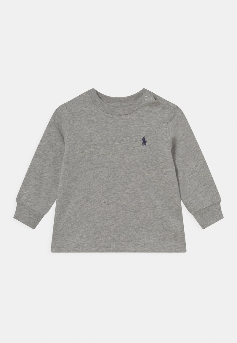 Gray long-sleeve shirt made of soft cotton. Features a crew neckline, ribbed cuffs, and a small navy logo on the chest.