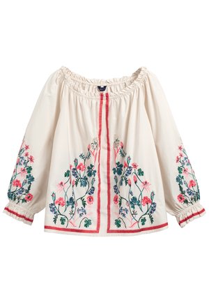 Blouse écrue épaules dénudées avec encolure et poignets élastiqués, broderie florale rose, verte et bleue sur le devant et les manches avec bordure rouge.