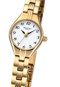 Montre-bracelet dorée avec un cadran blanc. Présente des index horaires noirs, des aiguilles noires élancées et un bracelet en maillons métalliques. Marque : Regent.
