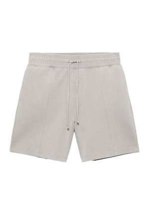 Hellgraue Freizeithose mit elastischem Bund und Kordelzug, mit vertikalen Nahtdetails an jedem Bein.