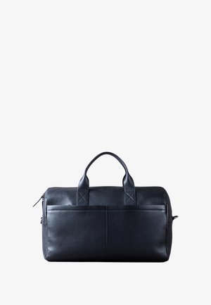Black leather duffel bag with two top handles, zip closure, and a front pocket. Textured surface and minimalist design with no visible hardware.