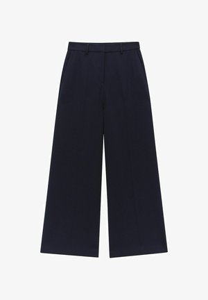 Navy leveled legginhousut, jotka on valmistettu sileästä kankaasta. Ominaisuuksiin kuuluu vyötärö, vyölenkit ja etutaskut. Selkeät linjat, ei näkyviä kuvioita.