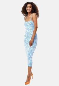 Blue zebra-striped bodycon dress with spaghetti straps, knee-length design, made from a stretchy fabric, paired with orange high heels.
