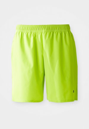 Shorts de bain verts lime éclatants avec ceinture élastique et poches latérales, présentés sur fond blanc uni.
