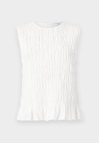 White sleeveless top with a gathered texture, featuring a round neckline and a ruffled hem. Made from soft, lightweight fabric.