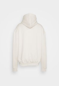 Felpa con cappuccio color crema, caratterizzata da una vestibilità comoda, polsini e orlo a coste, e tessuto morbido e strutturato. Vista posteriore solamente.