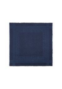 Marineblauwe, textuurrijke deken met een geometrisch patroon, franjes aan de randen en een plat geweven ontwerp, met verschillende tinten blauw binnen het patroon.