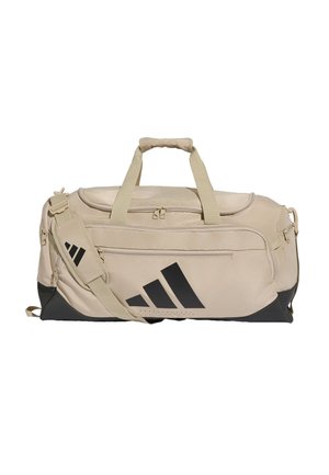Beige ja musta Adidas-laukku, jossa useita vetoketjullisia lokeroita, pehmustettu olkahihna ja yläosan kantokahvat.