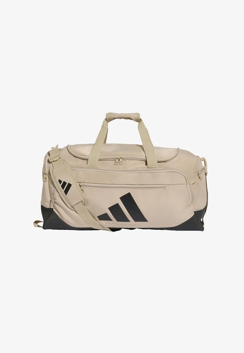 Μπεζ και μαύρη τσάντα Adidas με πολλαπλές θήκες με φερμουάρ, επενδεδυμένο ιμάντα ώμου και πάνω λαβές μεταφοράς.