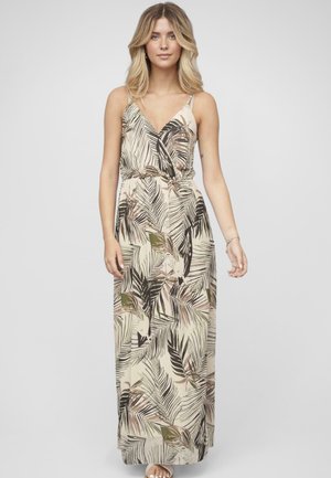 Robe maxi en tissu léger avec un fond crème orné de motifs de feuilles tropicales vertes et noires. Décolleté en V et bretelles spaghetti réglables.