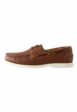 Brown leather boat shoe with white sole, lace-up front, and moc toe stitching, shown in profile facing left on white background.